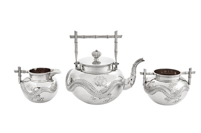 Lot 248 - An early 20th century Chinese Export silver three-piece tea service, Canton circa 1900 retailed by Wang Hing
