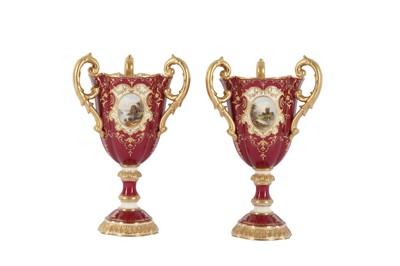 Lot 93 - A PAIR OF COALPORT PORCELAIN THREE HANDLED PEDESTAL CUPS, LATE 19TH/EARLY 20TH CENTURY