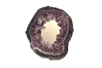 Lot 325 - A WALL MIRROR FORMED FROM AN AMETHYST GEODE, SOUTHERN BRAZIL