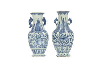 Lot 25 - A NEAR - PAIR OF CHINESE BLUE AND WHITE WALL VASES.