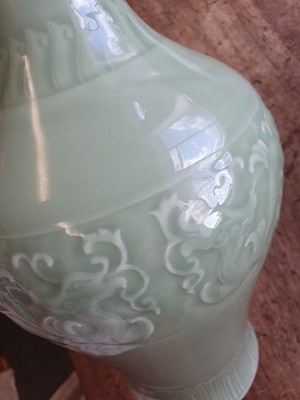 Lot 535 - A CHINESE CELADON-GLAZED 'DRAGON' VASE.