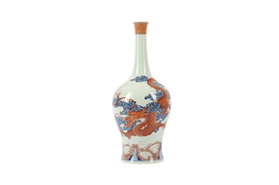 Lot 628 - A CHINESE BLUE AND WHITE AND IRON-RED 'DRAGON AND CARP' VASE.