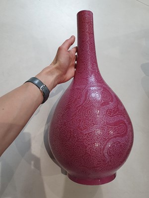 Lot 143 - A CHINESE PINK-GROUND SGRAFFITO 'DRAGON' BOTTLE VASE.