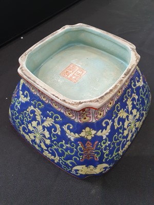 Lot 21 - A PAIR OF CHINESE FAMILLE ROSE BLUE-GROUND 'LOTUS AND BATS' BOWLS.