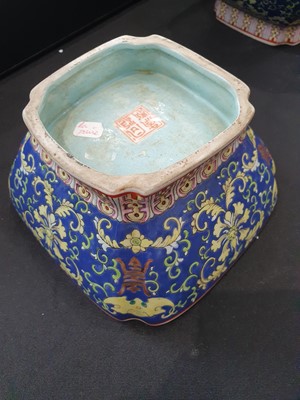 Lot 21 - A PAIR OF CHINESE FAMILLE ROSE BLUE-GROUND 'LOTUS AND BATS' BOWLS.