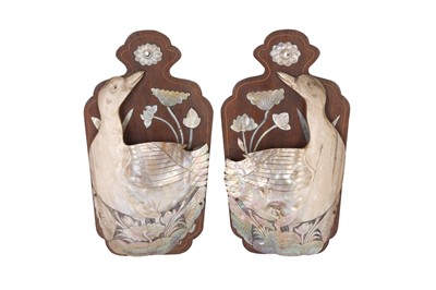 Lot 154 - A PAIR OF EARLY 20TH CENTURY INDO-CHINESE CARVED MOTHER OF PEARL WALL MOUNTS DEPICTING  SWANS