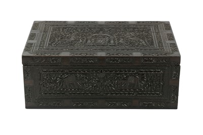 Lot 479 - A LARGE CARVED WOODEN TRAVEL BOX