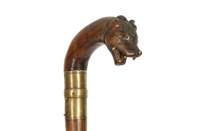Lot 415 - A WOODEN WALKING STICK WITH A HYENA HEAD