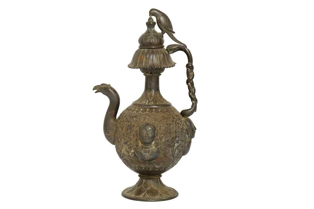 Lot 462 - A COPPER ALLOY REPOUSSÉ EWER WITH FIGURAL DECORATION