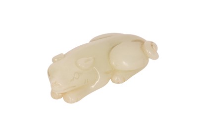 Lot 62 - A CHINESE PALE CELADON JADE 'DOG' CARVING.