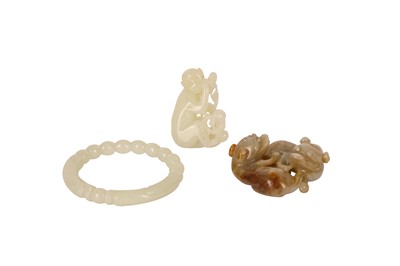 Lot 259 - TWO CHINESE PALE CELADON JADE CARVINGS AND A BANGLE.