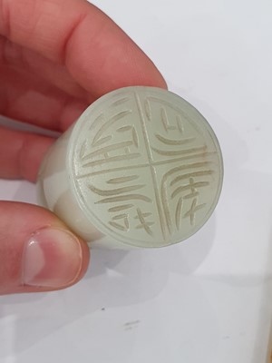 Lot 68 - TWO CHINESE PALE CELADON JADE PLAQUES, AN ARCHER'S RING AND A SEAL.