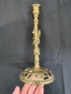 Lot 121 - A PAIR OF CHINESE BRONZE  'DRAGON' CANDLESTICKS.