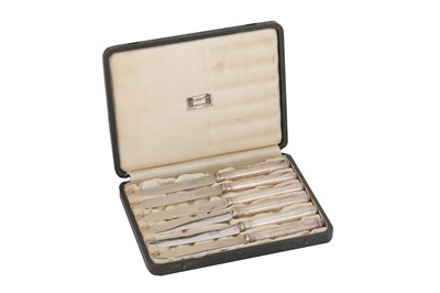 Lot 496 - A cased set of George V ‘Arts and Crafts’ sterling silver mounted tea knives, Birmingham 1927 by Liberty and Co