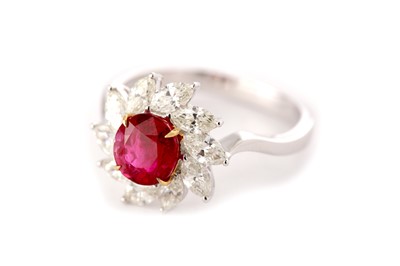 Lot 182 - A ruby and diamond cluster ring