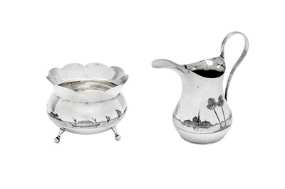 Lot 361 - An early 20th century Iraqi silver and niello milk and sugar, circa 1930 signed Shoodod