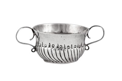 Lot 512 - A Queen Anne unmarked silver 'toy' miniature twin handled porringer or caudle cup, London  circa 1705