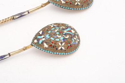 Lot 399 - A pair of Nicholas II Russian 84 zolotnik silver gilt and cloisonné enamel spoons, Moscow 1908-14 by Nikolai Nikolaievich Zverev (active 1908-14)