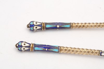 Lot 399 - A pair of Nicholas II Russian 84 zolotnik silver gilt and cloisonné enamel spoons, Moscow 1908-14 by Nikolai Nikolaievich Zverev (active 1908-14)