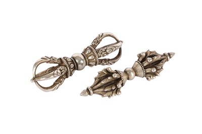 Lot 1104 - TWO TIBETAN SILVER VAJRAS.