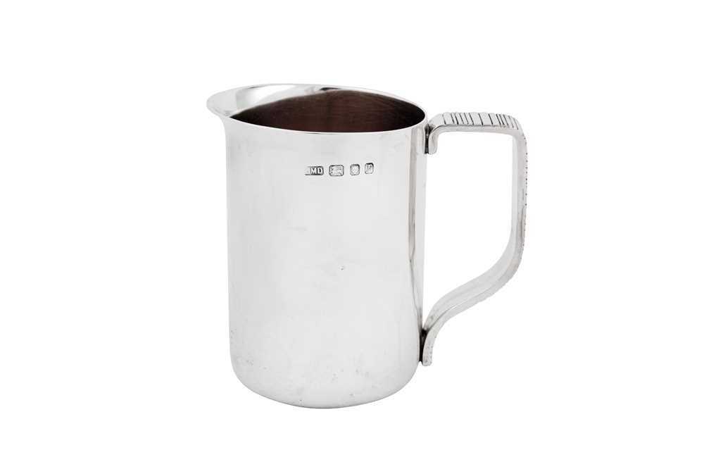 Lot 532 - A heavy Elizabeth II Modernist sterling silver milk jug, London 1970 by John Michael Driver