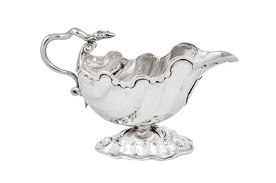 Lot 695 - A George II sterling silver sauce boat, London circa 1746 probably by Charles Woodward (reg. 10th April 1741)