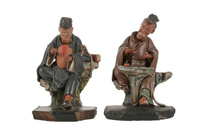 Lot 577 - A PAIR OF CHINESE PAINTED TERRACOTTA NODDING FIGURES.