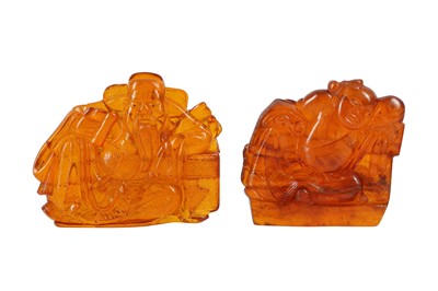 Lot 700 - TWO CHINESE AMBER CARVINGS.
