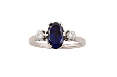 Lot 43 - A sapphire and diamond three-stone ring