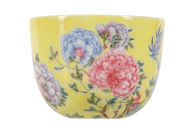 Lot 406 - A CHINESE FAMILLE ROSE YELLOW-GROUND 'PEONIES' CUP.
