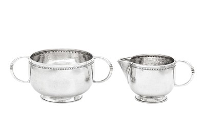 Lot 505 - A George V ‘Arts and Crafts’ sterling silver strawberry set, Birmingham 1912 by Liberty and Co