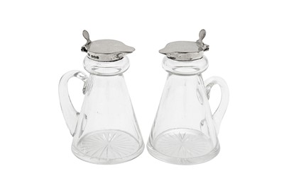 Lot 79 - A pair of George VI sterling silver mounted glass whiskey noggins, Birmingham 1938 by Hukin and Heath
