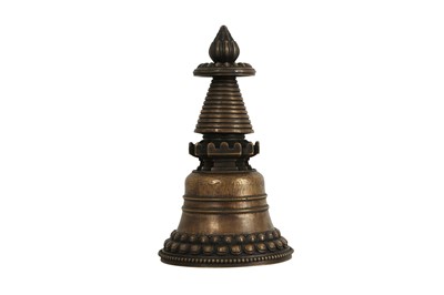 Lot 1100 - A TIBETAN BRONZE STUPA.