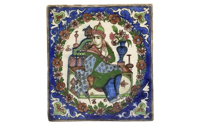 Lot 511 - A POTTERY TILE DEPICTING A SEATED PRINCE