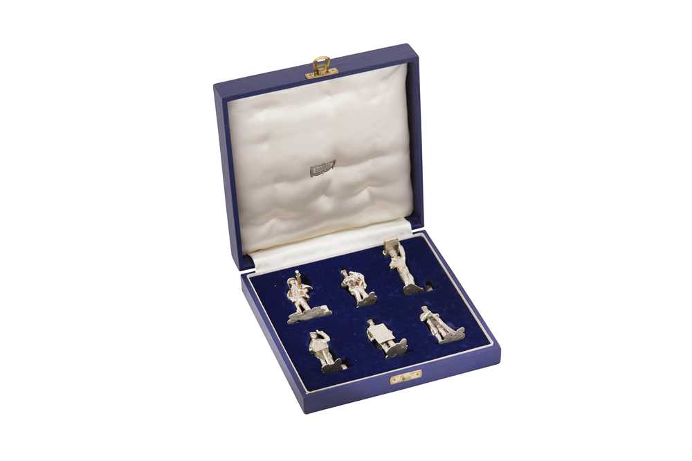 Lot 90 - A cased set of Elizabeth II sterling silver novelty Workers of London place card holders, London 1970 by WJH incuse