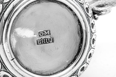 Lot 175 - A late 19th century Anglo – Indian silver milk or cream jug, Cutch, Bhuj circa 1880 by Oomersi Mawji (active 1860-90)