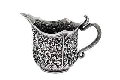 Lot 175 - A late 19th century Anglo – Indian silver milk or cream jug, Cutch, Bhuj circa 1880 by Oomersi Mawji (active 1860-90)