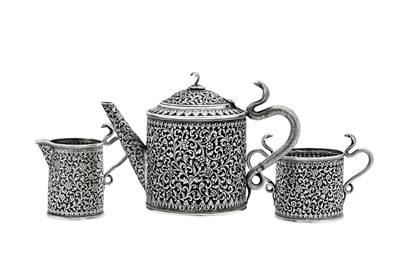 Lot 178 - A late 19th / early 20th century Anglo – Indian silver three-piece tea service, Cutch, Bhuj circa 1900 by Oomersi Mawji jnr (active 1890-1930)