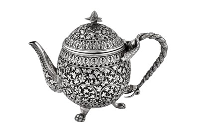 Lot 170 - A late 19th century Anglo – Indian unmarked silver teapot, Cutch circa 1880