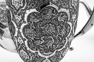 Lot 311 - A mid-20th century Iranian (Persian) silver four-piece tea and coffee service, Isfahan circa 1950 mark of Kazeem