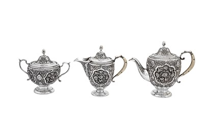 Lot 311 - A mid-20th century Iranian (Persian) silver four-piece tea and coffee service, Isfahan circa 1950 mark of Kazeem