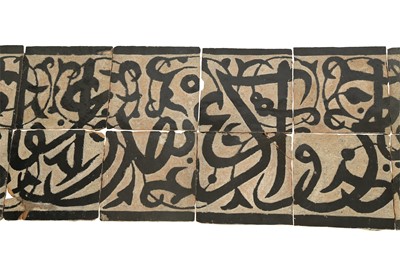 Lot 531 - A MARINID-REVIVAL BLACK CALLIGRAPHIC POTTERY FRIEZE