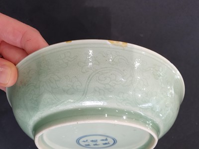 Lot 568 - A CHINESE INCISED CELADON 'DRAGONS' DISH.