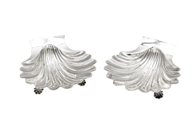 Lot 686 - A pair of early George III sterling silver butter shells, London 1764 by John Romer