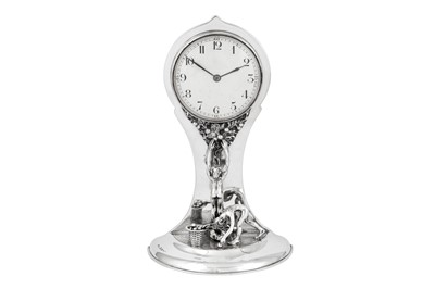 Lot 510 - A George V sterling silver figural mantle clock, Birmingham 1913 by William Hair Haseler