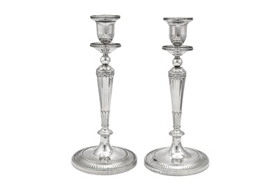 Lot 674 - An unusual pair of George III sterling silver candlesticks, London 1790 by John Wakelin & William Taylor (reg. 25th Sep 1776)