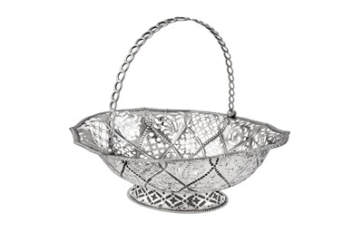Lot 661 - A George III Irish sterling silver bread basket, Dublin circa 1770 by Charles Mullen (active 1768-80)
