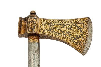 Lot 152 - A PERSIAN CEREMONIAL STEEL AXE WITH GOLD-DAMASCENED HEAD (TABARZIN)