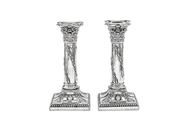 Lot 587 - A pair of Victorian sterling silver candlesticks, London 1899 by Thomas Bradbury and Sons