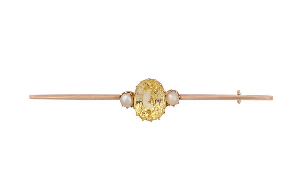 Lot 159 - A yellow sapphire and pearl bar brooch, circa 1905